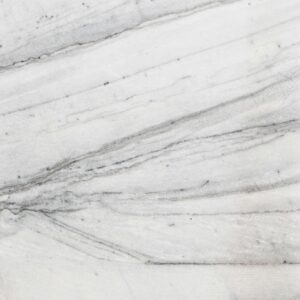 Close-up of a textured white marble surface with natural lines and patterns.