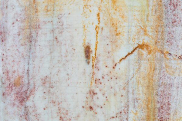 High-resolution close-up of a vibrant marble texture with natural patterns.