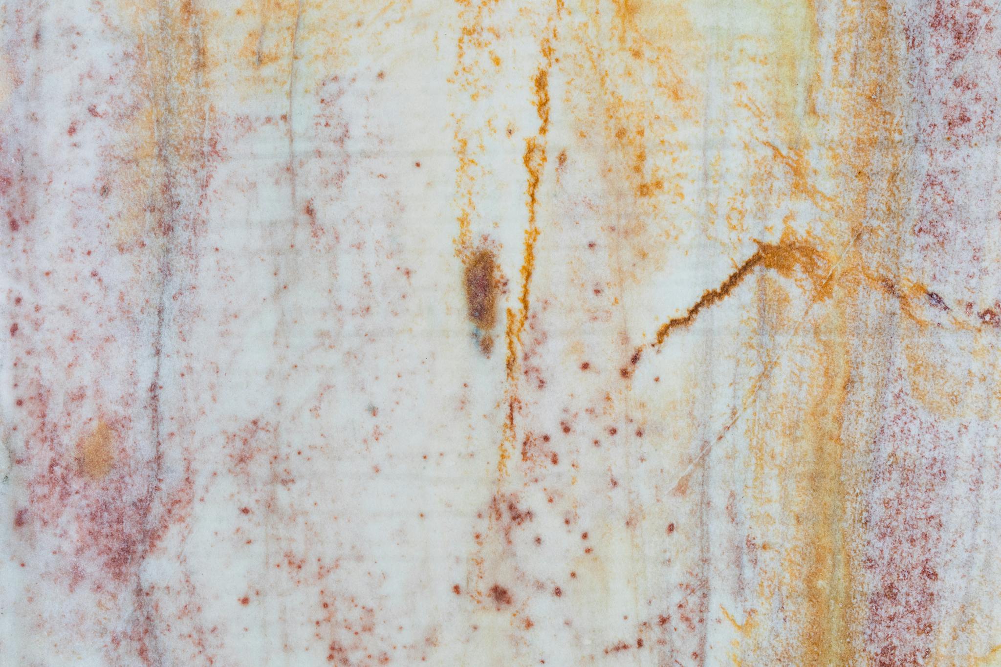 High-resolution close-up of a vibrant marble texture with natural patterns.