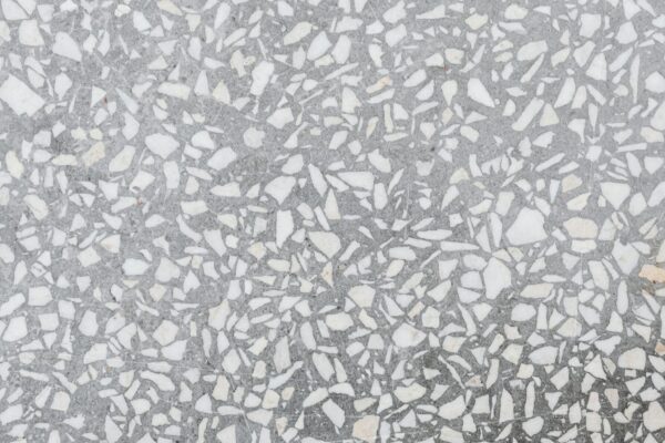 High-resolution image of a classic terrazzo stone texture with white and gray patterns.